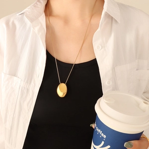 Minimalist gold-plated stainless steel necklace with polished oval pebble pendant for women