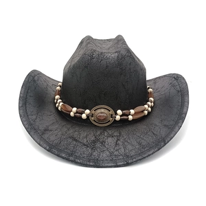 Detail showing distressed black faux-leather texture and beaded band on western cowboy hat