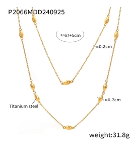 Detail view of gold double-layer titanium steel necklace showing link size and texture