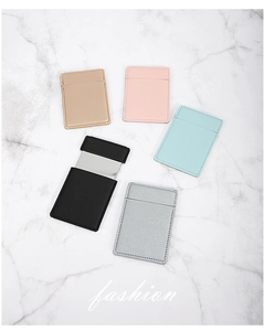 Detail of colorful faux leather sleeves with pull-out stainless steel mirrors on marble