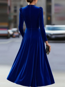 Back view of elegant navy blue velvet long-sleeve dress showing high-quality fabric texture