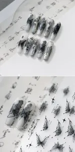 Detail of ink butterfly nail stickers and long coffin nails with Zen calligraphy style