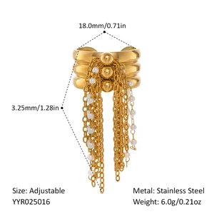 Detail of adjustable gold stainless steel ring with wave texture and pearl tassel charms