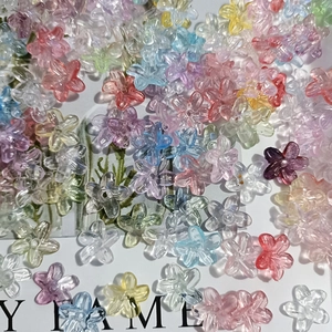 Close-up of colorful gradient five-petal mini beads for DIY jewelry and flower decor