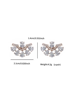 Detail view of fan-shaped rose gold earrings with cubic zirconia stones and measurements