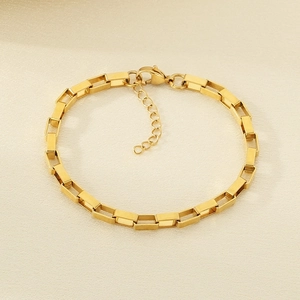 Detail of 18k gold plated rectangular link chain bracelet with lobster clasp and extender