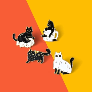 Detailed set of 4 enamel cat pins with gold stars and clouds on orange-yellow background