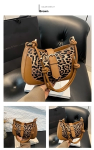 Detail of leopard print patchwork shoulder bag featuring metallic buckle and knot strap