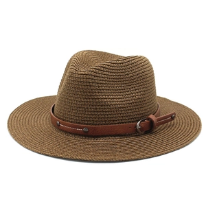Close-up of woven straw fedora hat with brown leather band and metallic buckle detail