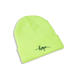 Detail of neon green ribbed knit beanie featuring black embroidered hope text on cuff