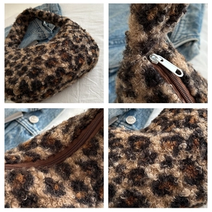 Macro detail of leopard print faux fur bag showing the zipper and soft texture