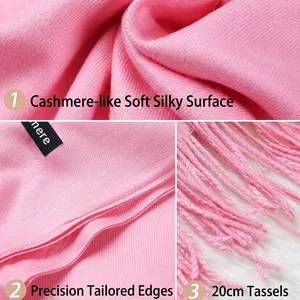 Pink cashmere-feel scarf with long tassels and detailed stitching in close-up shots