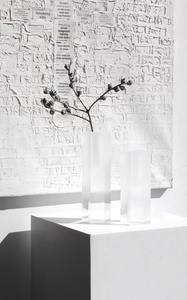 Artistic detail of two gradient acrylic vases in rectangular shape for minimalist decor