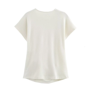 Back view of white short sleeve top with soft knitted texture and clean minimalist finish