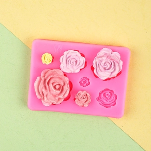 Pink silicone mold with 3D rose flower cavities for soap and chocolate cake decoration