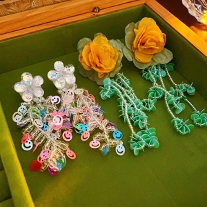 Bohemian floral tassel earrings with white flowers and colorful beaded long chain drops