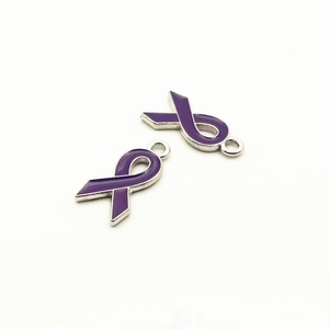 Macro view of purple enamel ribbon charms with silver metal edges for DIY jewelry