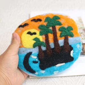Handmade wool felt coin purse featuring a vibrant tropical island sunset with palm trees