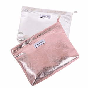 Close-up of premium metallic pink and silver makeup bags with durable zip closures