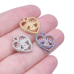 Three hollow heart-shaped eye charms in gold, silver, and rainbow steel finish