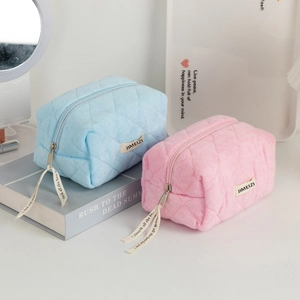 Quilted makeup bag set in blue and pink features a large capacity and zipper ribbons