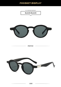 Close-up of black retro round sunglasses with silver metal temple decor and dark lenses
