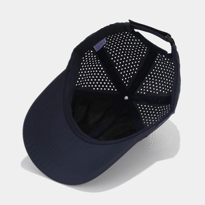 Dark blue quick-dry baseball cap with laser-cut breathability holes and adjustable strap