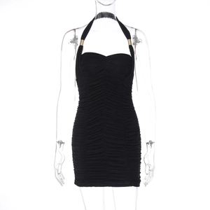 Detail of black halter neck dress featuring ruched fabric and metallic ring buckles