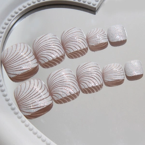 Sparkly white shell pattern press-on toe nails with fine glitter finish and 10 pieces set
