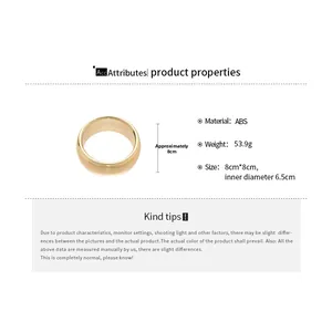 Detailed view of glossy gold ABS bangle showing 8cm outer and 6.5cm inner diameter