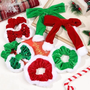 Detailed set of Christmas velvet scrunchies and bow hair clips with plush trim and sequins