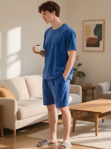 Close-up of blue velvet men's short sleeve loungewear set with soft texture details