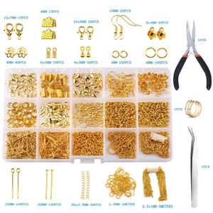 Macro view of gold jewelry making kit with lobster clasps, ear hooks, and pliers