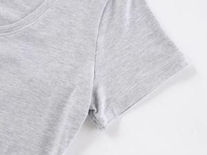 Detail view of the gray U-neck t-shirt showing high-quality stitching and cotton texture