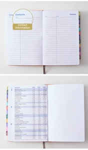 Detail of multi-color monthly index tabs and 2024-2026 holiday calendar pages in the planner