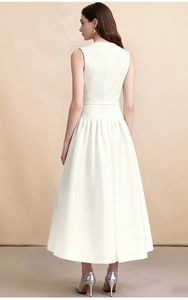 Detail of the back cut and satin texture of a white sleeveless midi dress with belt