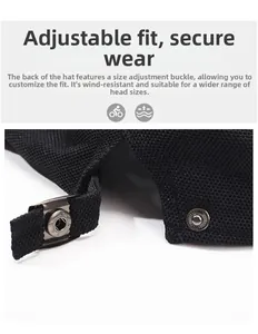 Detail of adjustable metal buckle and breathable mesh fabric on back of black cap