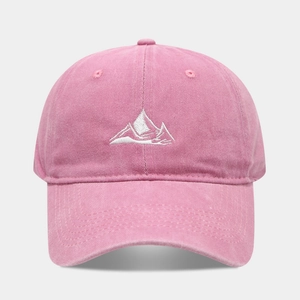 Close-up of pink washed cotton baseball cap with white mountain embroidery detail