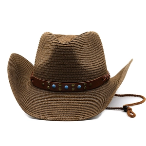 Detail of turquoise stones and metallic studs on the brown woven cowboy hat band