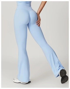 Detail of high waisted flared yoga pants featuring back seam for butt lifting effect