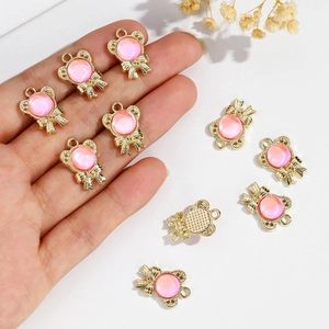 Golden alloy bow pendant with pink gemstone for DIY jewelry making handmade crafts