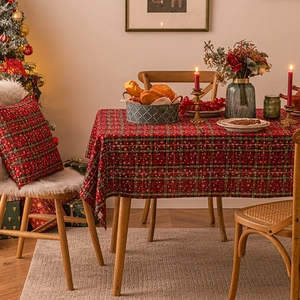 Christmas red and green plaid tablecloth with snowflake prints in a festive dining room