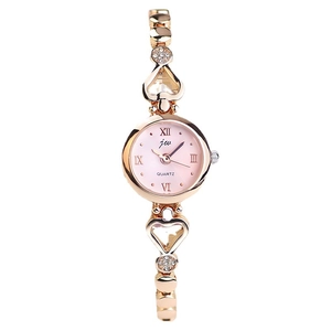 Elegant rose gold women's quartz watch with pink dial and heart-shaped crystal bracelet