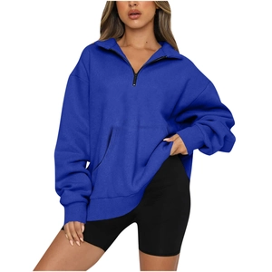 Women's blue half-zip sweatshirt with collar and pockets for casual athletic wear