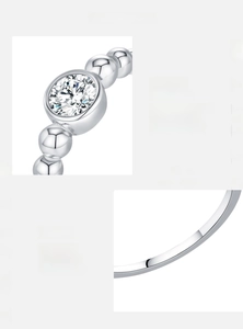 Detail of Moissanite D color VVS1 3EX cut stone set in S925 sterling silver bubble ring