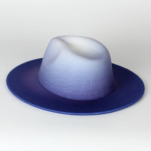 Detail of blue and white gradient felt fedora hat showing thick wool texture and flat brim