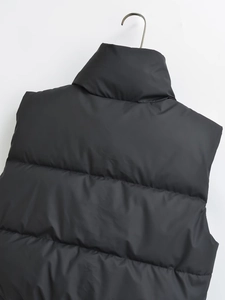Back view of black padded puffer vest with stand collar and horizontal quilting