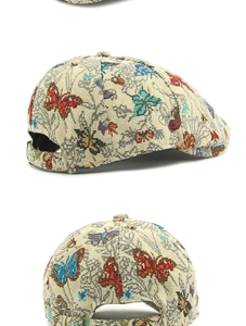 Macro detail of butterfly jacquard texture and adjustable metal buckle on retro beret hat