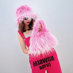 Detailed texture of fluffy pink faux fur hat and matching plush handbag set