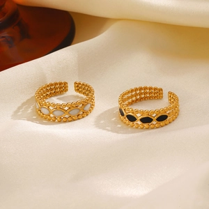 18K gold plated rhombus geometric rings with black and white drip oil on beige silk